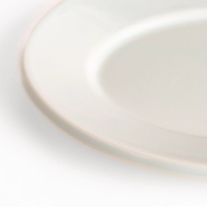 Durable and elegant white ceramic salad plate, adding a pop of color to your table setting.