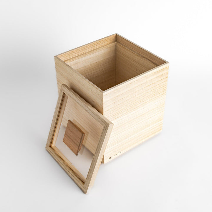 Square paulownia wood rice box with a minimalist design and wooden lid, ideal for stylish and functional storage.