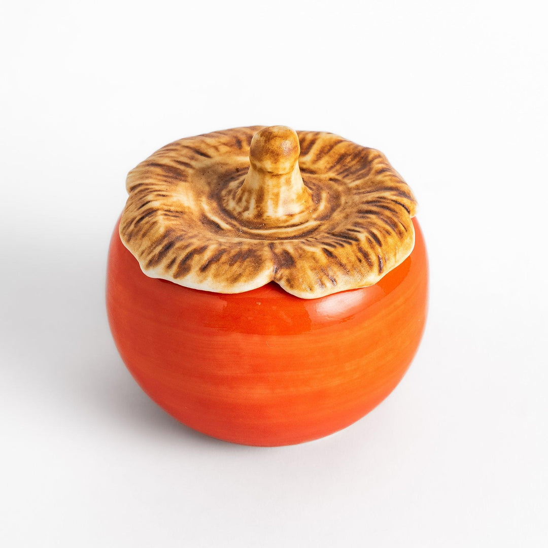 Green apple shaped ceramic condiment bowl with glossy finish and lid perfect for sauces or condiments.