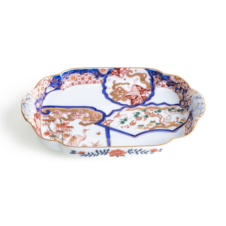 Rectangular salad plate with handles featuring cranes and trees bordered by red blue and gold patterns.