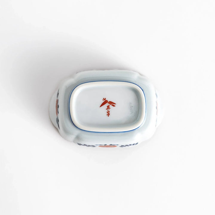 Vibrant condiment bowl with pine bamboo and plum motifs cranes and gold details and flared edge design.