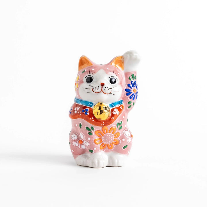 Pink blossom Maneki Neko figurine with floral patterns and gold bell symbolizing good luck and prosperity.