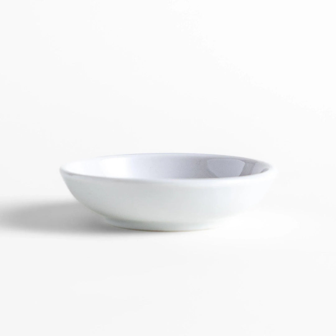 White ceramic Japanese incense holder with pink rose design adding elegant floral touch to any space.