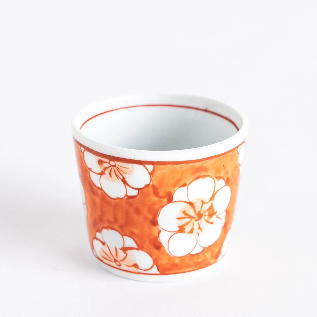 A small porcelain condiment bowl adorned with a blue floral pattern and soft brush strokes.