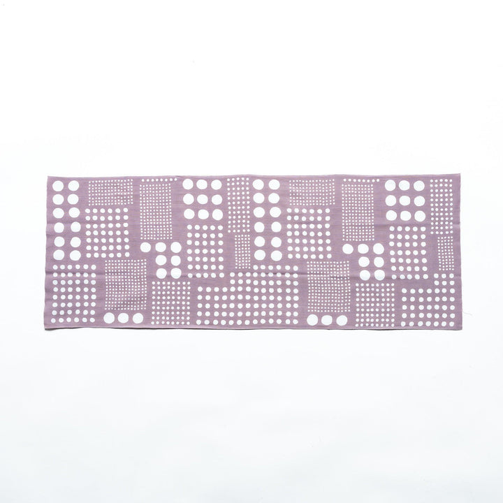 Purple gray polka dot tenugui hand towel laid flat, showing white dots arranged in square patterns.