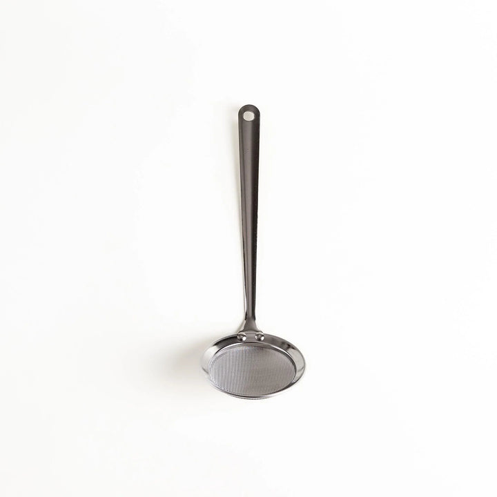 Stainless steel skimmer with fine mesh and long handle perfect for removing scum from soups or broths.