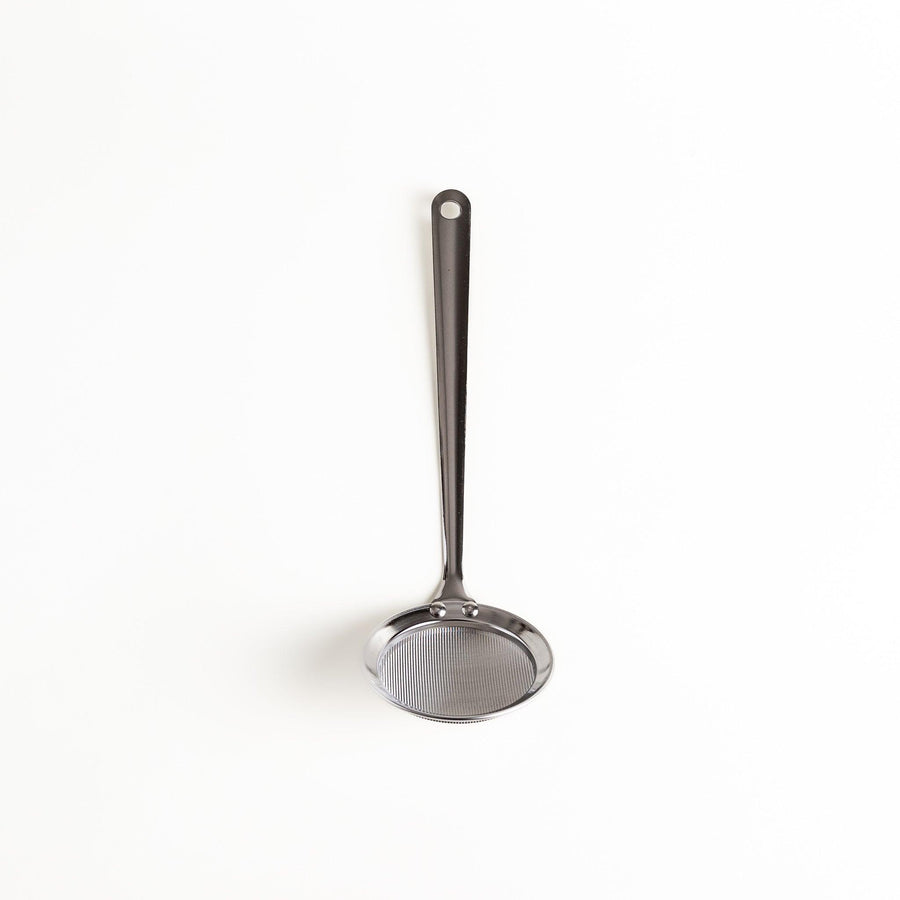 Stainless steel skimmer with fine mesh and long handle perfect for removing scum from soups or broths.