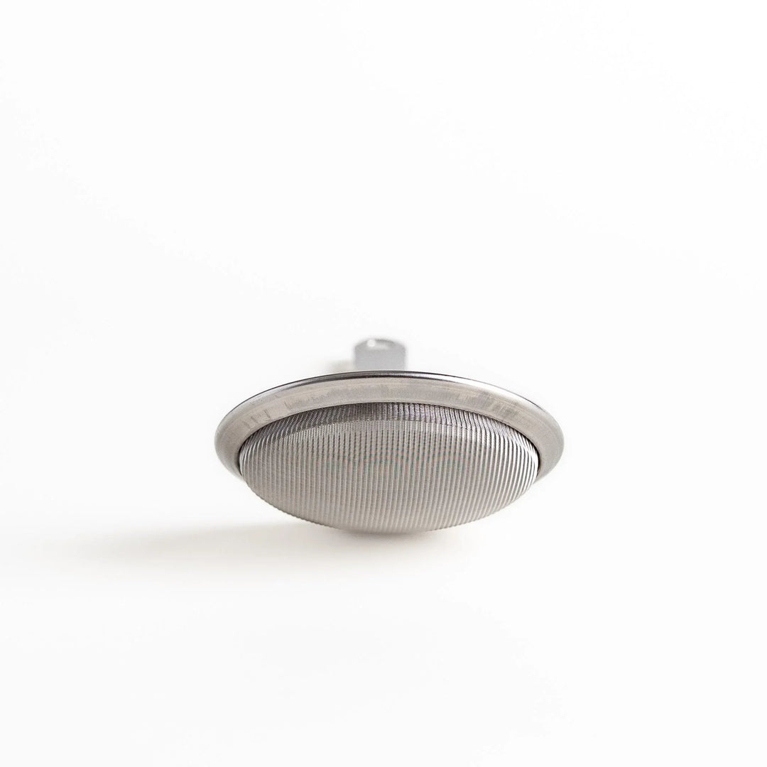 Stainless steel skimmer with fine mesh and long handle perfect for removing scum from soups or broths.