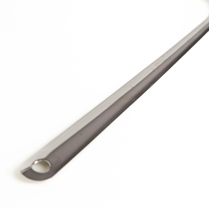 Stainless steel skimmer with fine mesh and long handle perfect for removing scum from soups or broths.