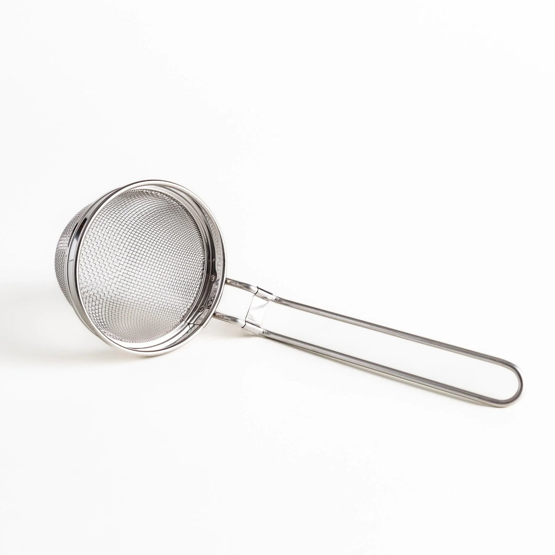 Stainless steel miso strainer with fine mesh and long handle perfect for making smooth miso soup.