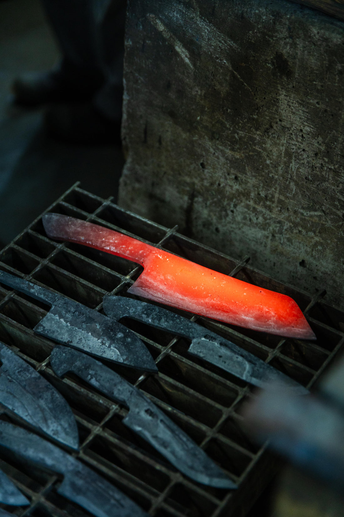 Japanese Tosa knife blacksmith forging a handcrafted kitchen knife at Kurotori workshop in Kochi Japan