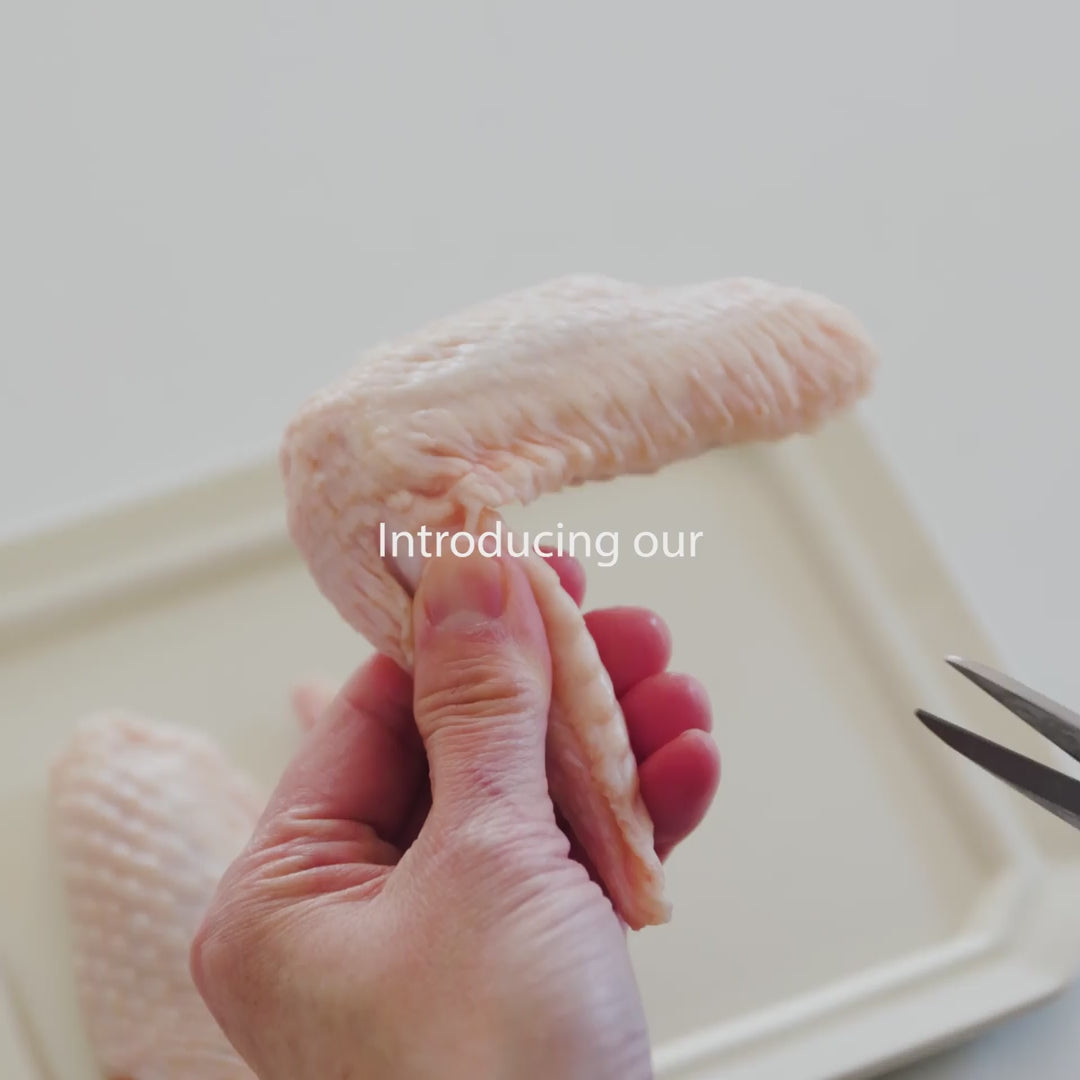 Japanese kitchen scissors being hand sharpened by a skilled craftsman in a traditional Japanese workshop