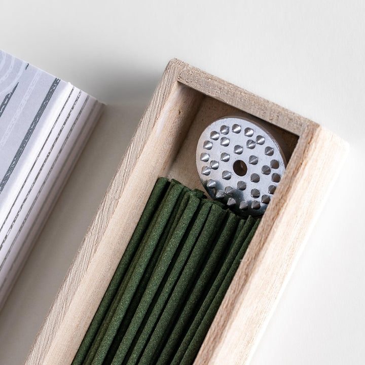 White sage incense sticks in a patterned box with holder, offering a clean herbal aroma that refreshes and purifies any space