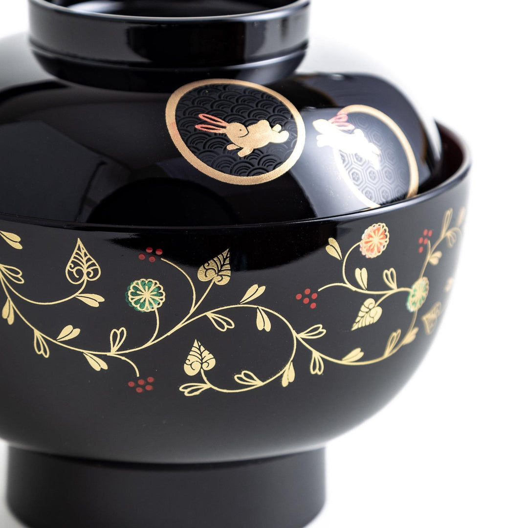 Lacquered soup bowls with lids, featuring golden vine designs. Available in red or black.
