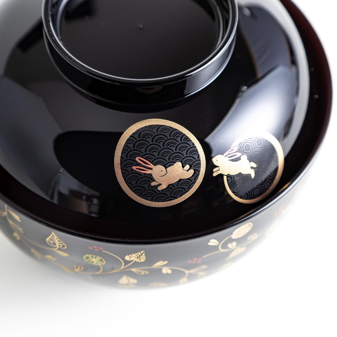 Lacquered soup bowls with lids, featuring golden vine designs. Available in red or black.