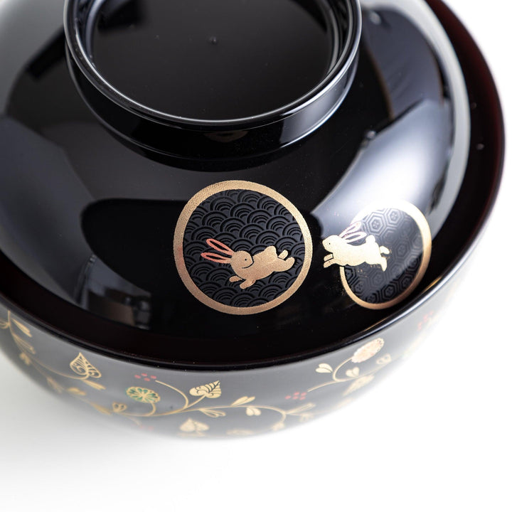Lacquered soup bowls with lids, featuring golden vine designs. Available in red or black.