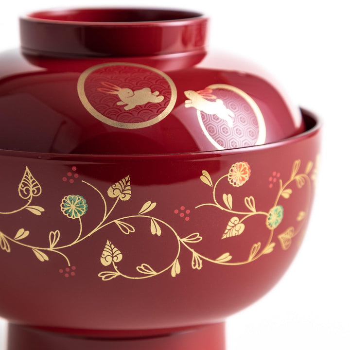 Lacquered soup bowls with lids, featuring golden vine designs. Available in red or black.