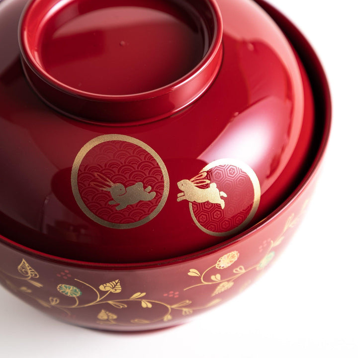 Lacquered soup bowls with lids, featuring golden vine designs. Available in red or black.