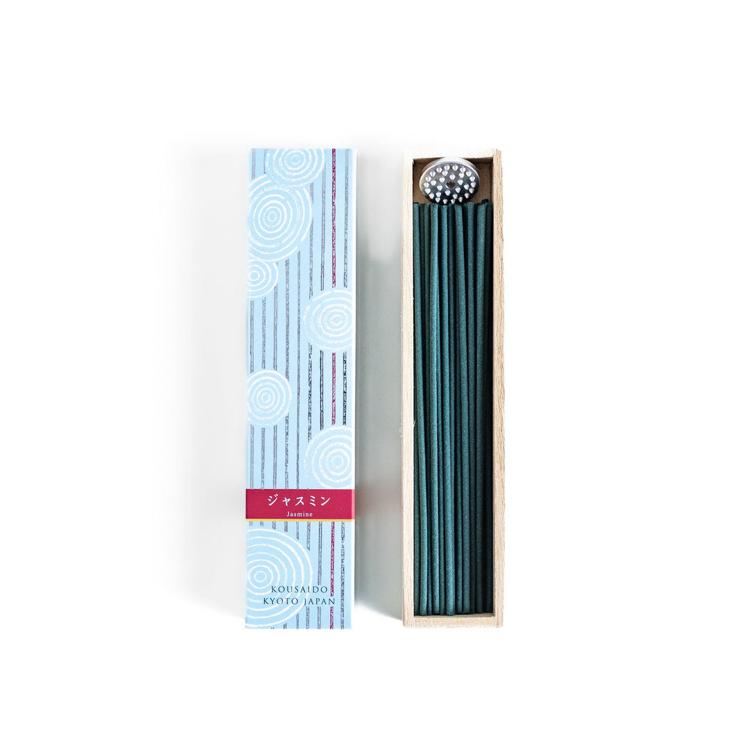 Japanese jasmine incense in wooden box with teal sticks and white circle pattern design for fresh floral scent.