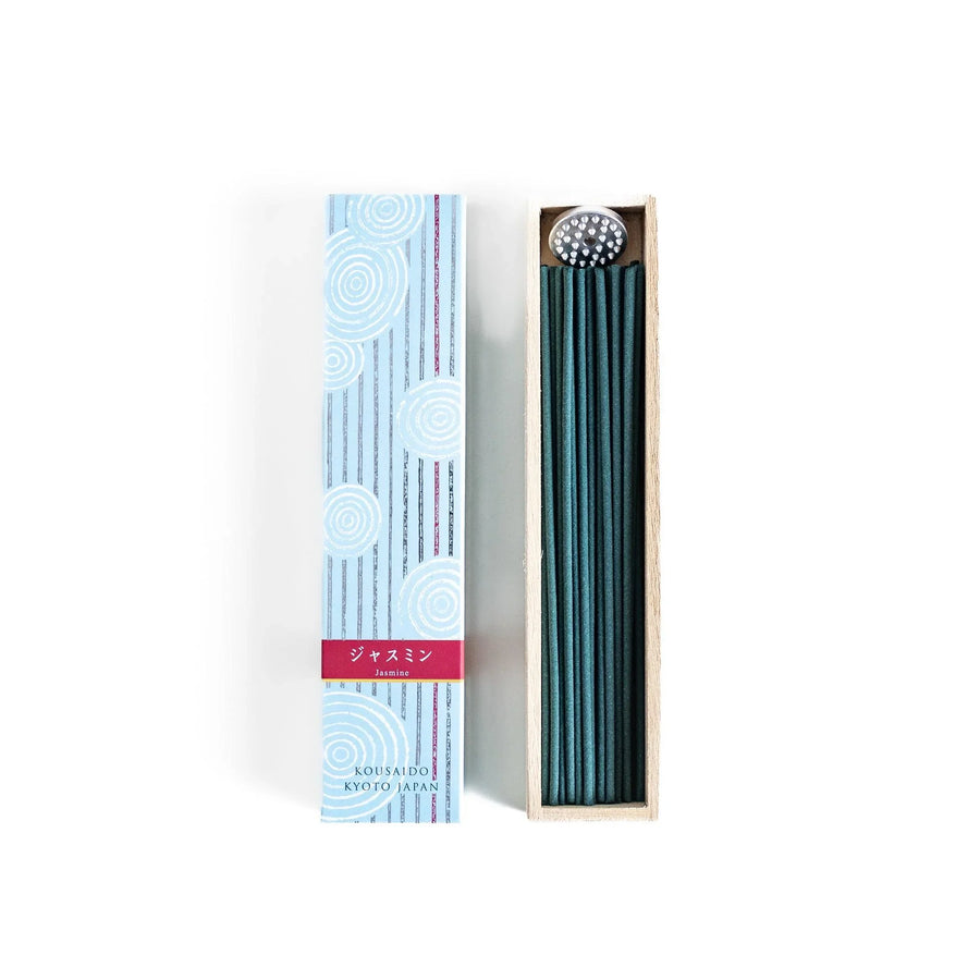 Japanese jasmine incense in wooden box with teal sticks and white circle pattern design for fresh floral scent.