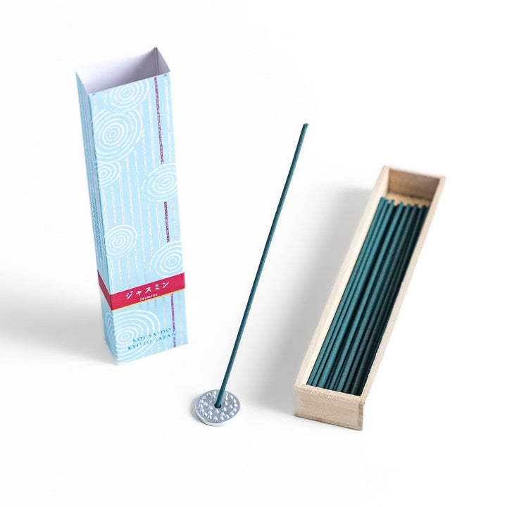 Japanese jasmine incense in wooden box with teal sticks and white circle pattern design for fresh floral scent.