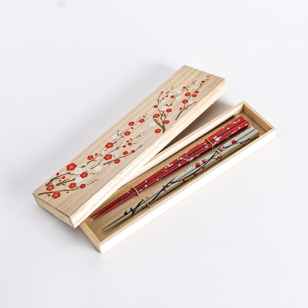 Chopsticks set in wooden box with plum blossom lid design adding refined charm to Japanese gifting.