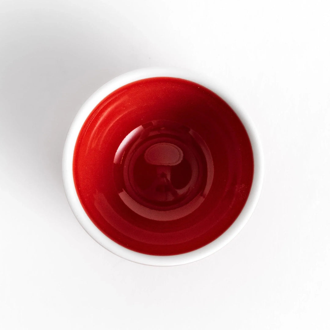 Red apple shaped ceramic condiment bowl with glossy finish and lid perfect for sauces or condiments.