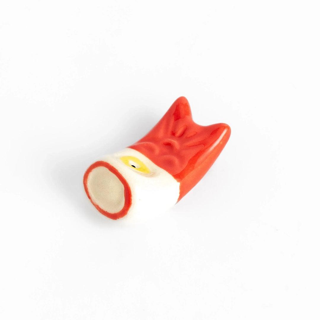 Chopstick rest shaped like a red carp streamer with intricate details and a playful, colorful design.