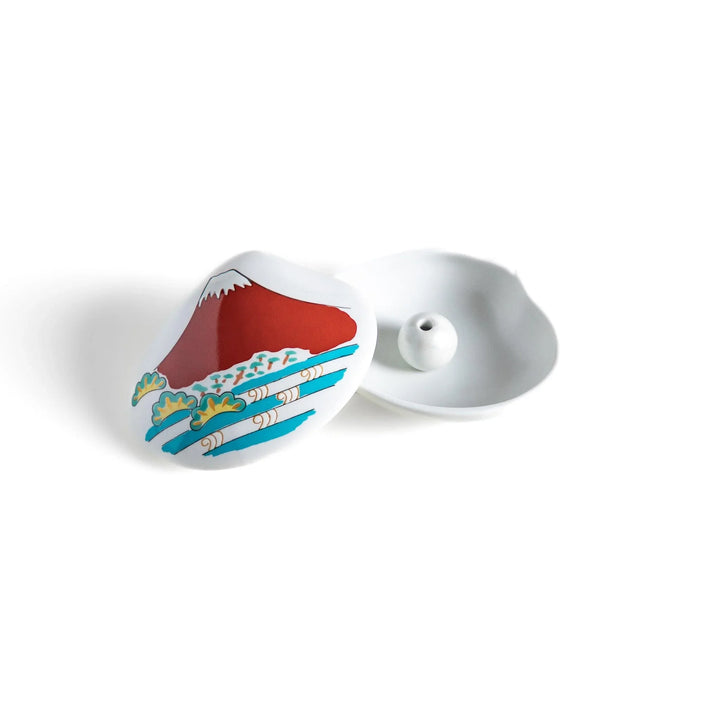 White ceramic seashell incense holder with red Mount Fuji and gold accents for elegant Japanese decor.