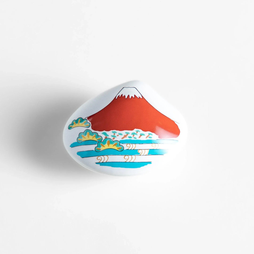 White ceramic seashell incense holder with red Mount Fuji and gold accents for elegant Japanese decor.