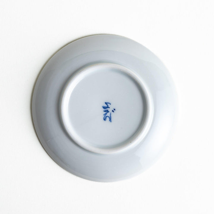 Round plate with a red chrysanthemum petal design.