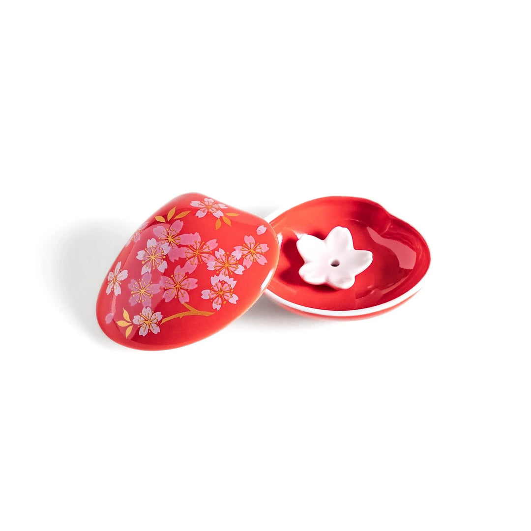 Red sakura shell incense holder with floral lid and blossom stand designed to catch ash and enhance any space.