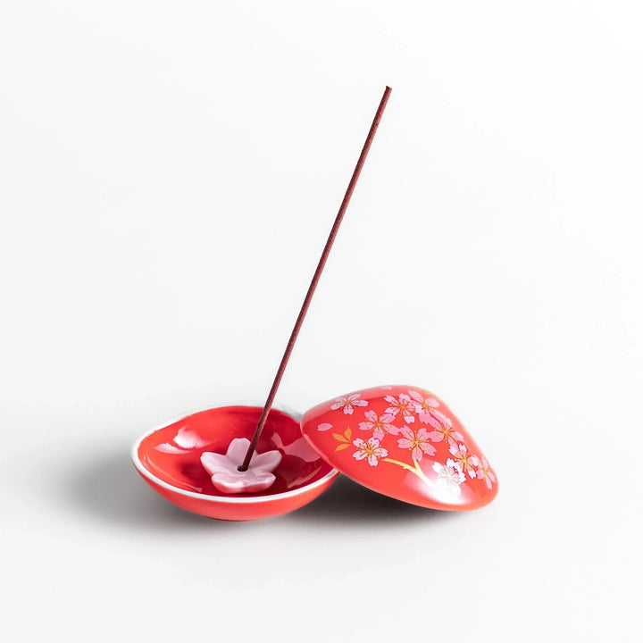 Red sakura shell incense holder with floral lid and blossom stand designed to catch ash and enhance any space.