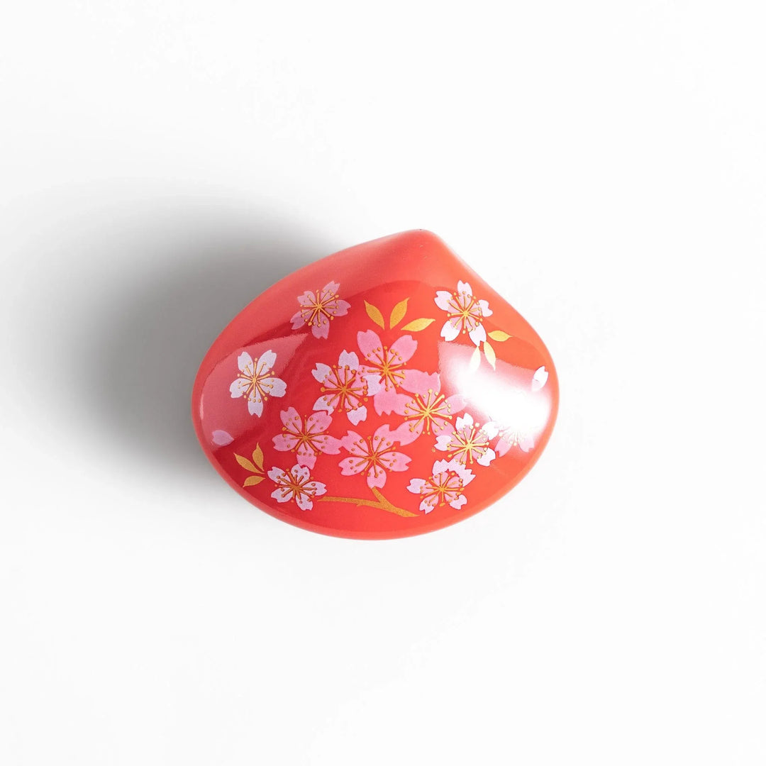 Red sakura shell incense holder with floral lid and blossom stand designed to catch ash and enhance any space.