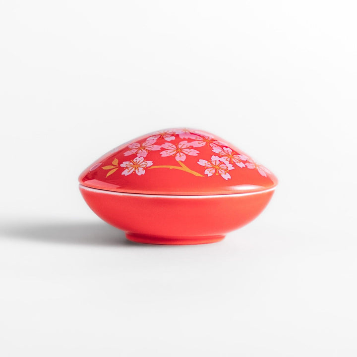 Red sakura shell incense holder with floral lid and blossom stand designed to catch ash and enhance any space.