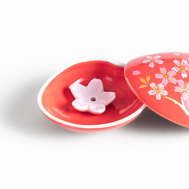 Red sakura shell incense holder with floral lid and blossom stand designed to catch ash and enhance any space.