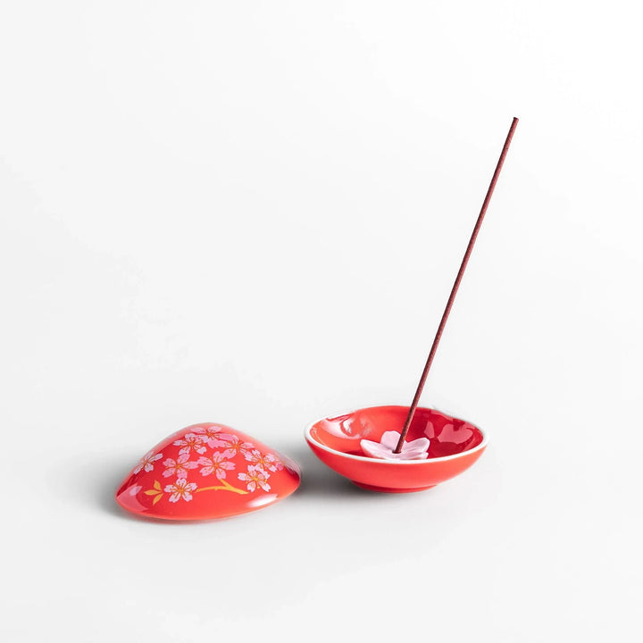 Red sakura shell incense holder with floral lid and blossom stand designed to catch ash and enhance any space.