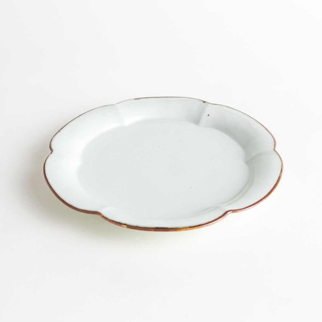 Earthy tones of olive, caramel, or off-white salad plate, with a soft, rounded shape and subtle color variations.