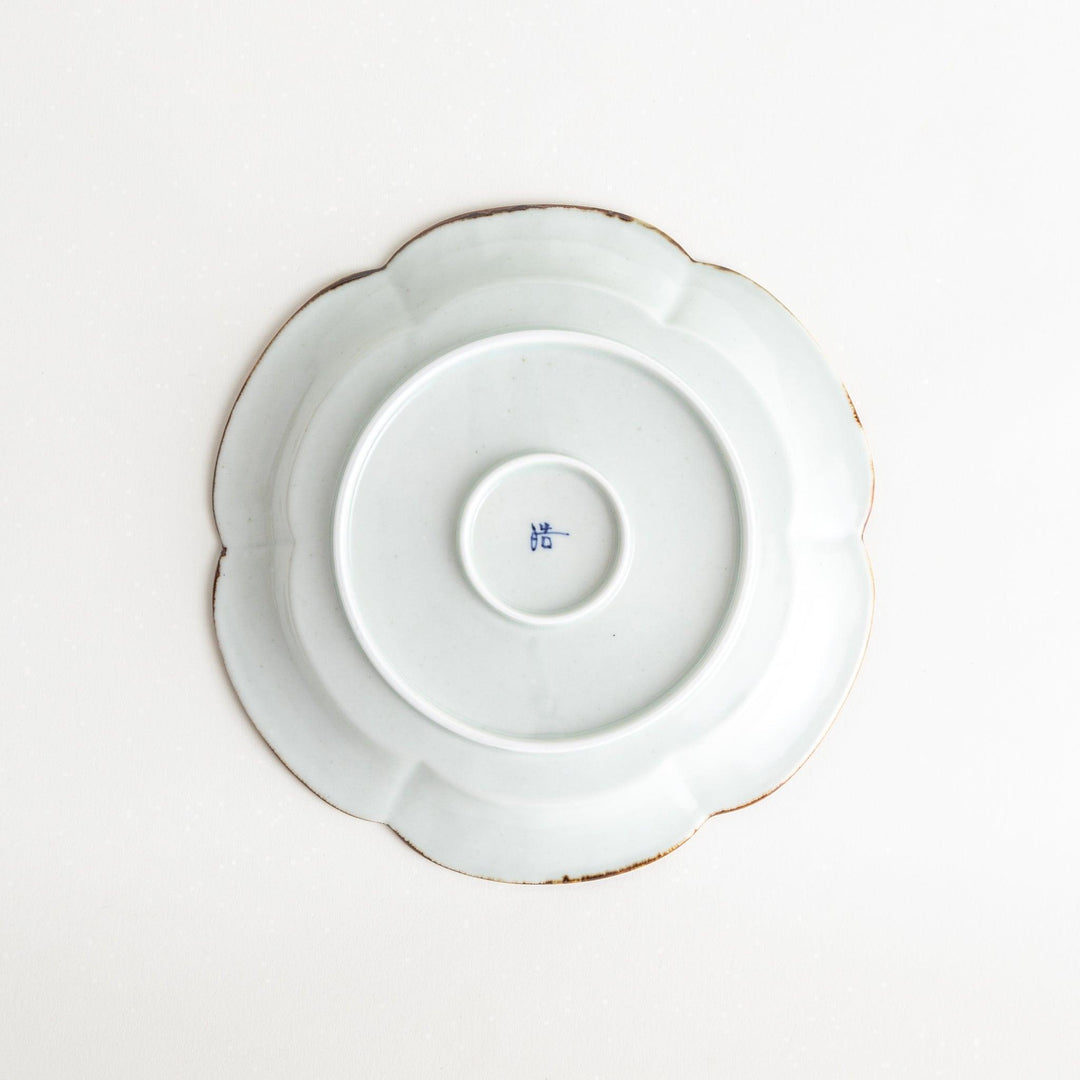 Earthy tones of olive, caramel, or off-white salad plate, with a soft, rounded shape and subtle color variations.