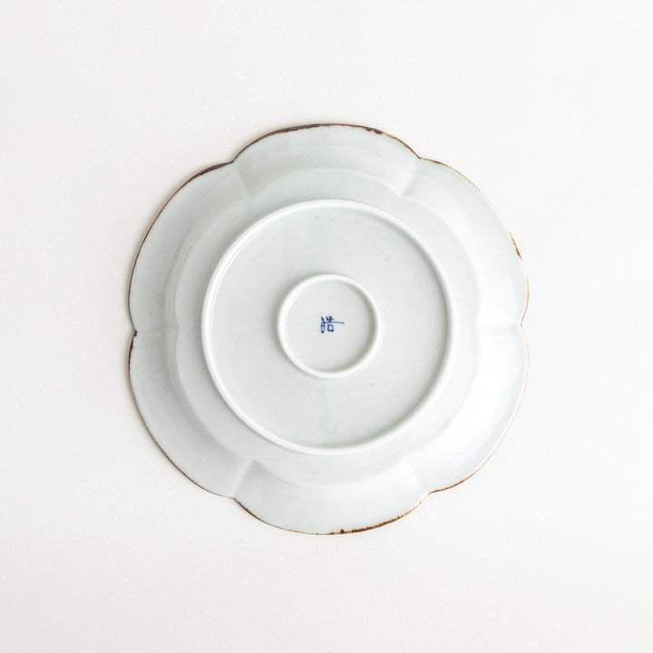 Earthy tones of olive, caramel, or off-white salad plate, with a soft, rounded shape and subtle color variations.