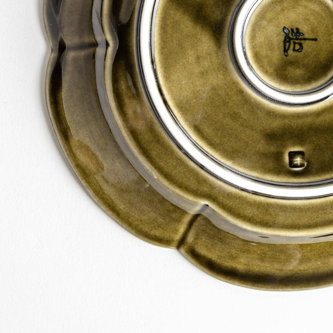 Earthy tones of olive, caramel, or off-white salad plate, with a soft, rounded shape and subtle color variations.