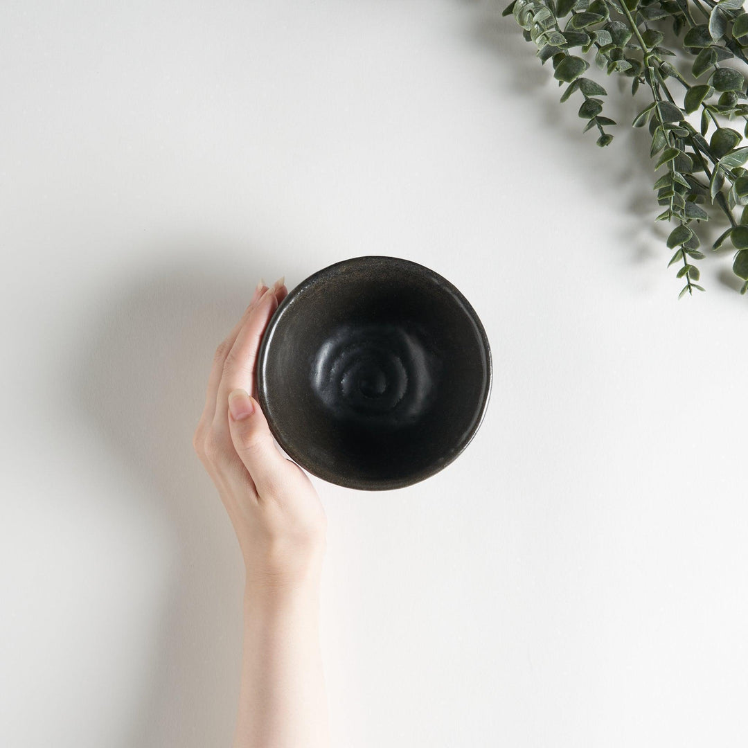 White ceramic rice bowl with soft, fluted edges.