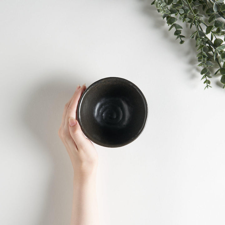 White ceramic rice bowl with soft, fluted edges.