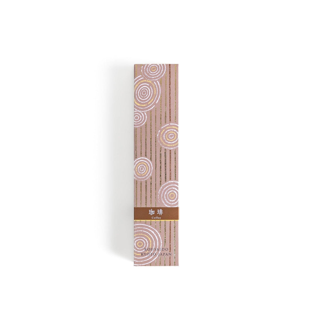 Brown incense sticks in a wooden box with beige packaging and white circular patterns evoking coffee aroma.