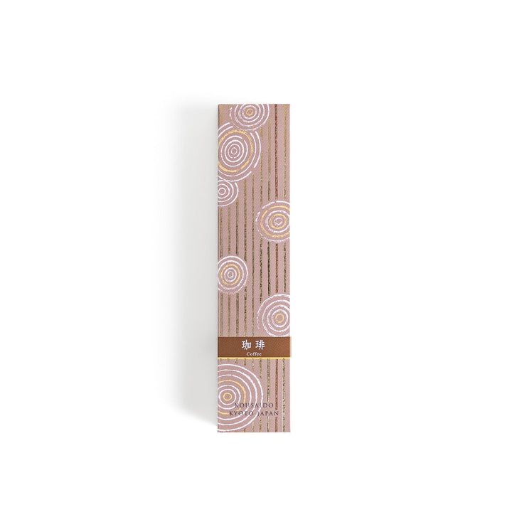 Brown incense sticks in a wooden box with beige packaging and white circular patterns evoking coffee aroma.