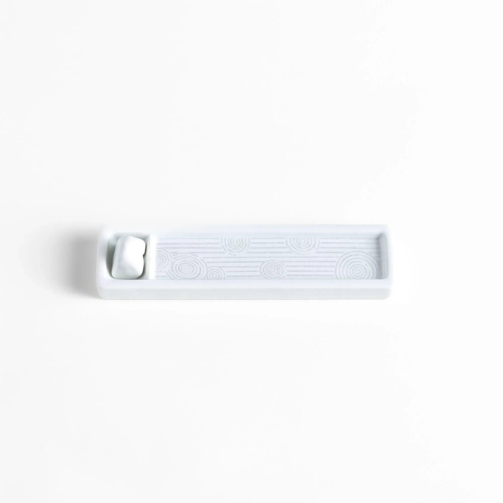 Zen-inspired white ceramic Incense Holder featuring a raked sand pattern.