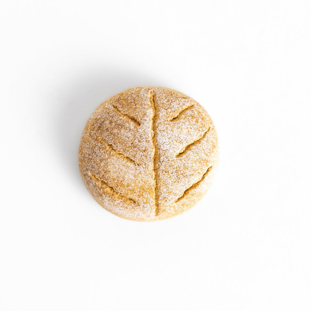 Rustic bread-shaped chopstick rest, featuring a natural, earthy design with a leaf-like scoring on top.