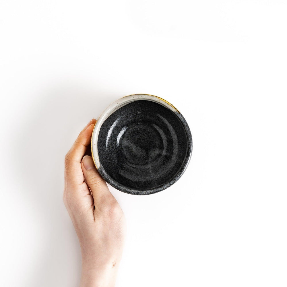 Black matcha bowl with gold crackle glaze in wooden box perfect for elegant Japanese tea ceremonies.