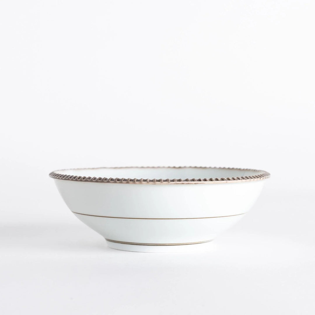Rustic scallop edged cereal bowl with earthy tones perfect for breakfast soups or Japanese rice dishes.