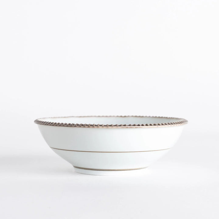 Rustic scallop edged cereal bowl with earthy tones perfect for breakfast soups or Japanese rice dishes.